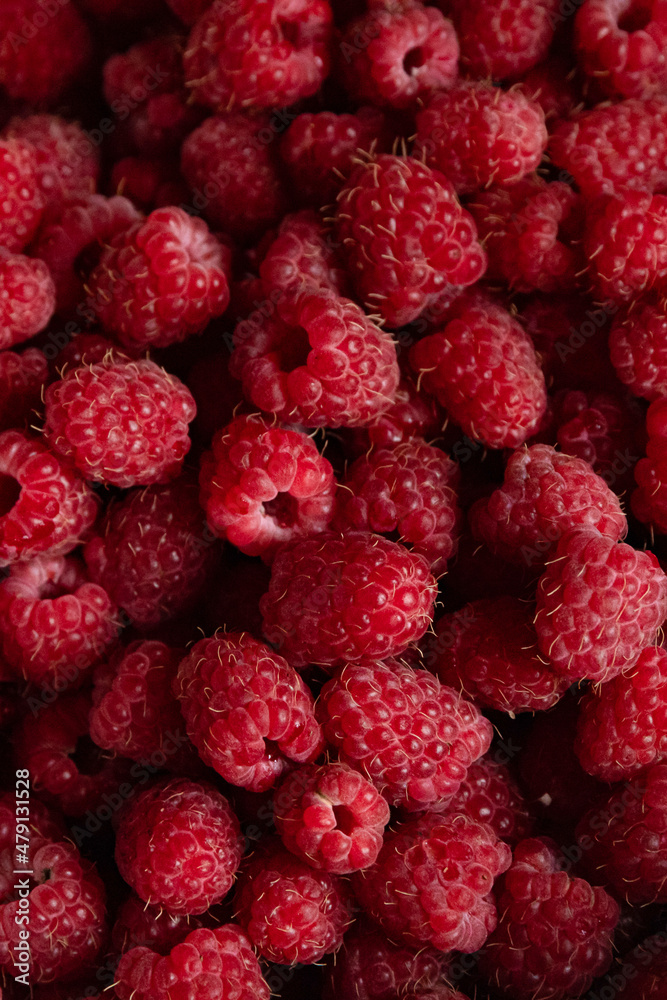 Raspberry berries close-up. Background of ripe red raspberries, close up Raspberry berries close-up. Background of ripe red raspberries, close up
