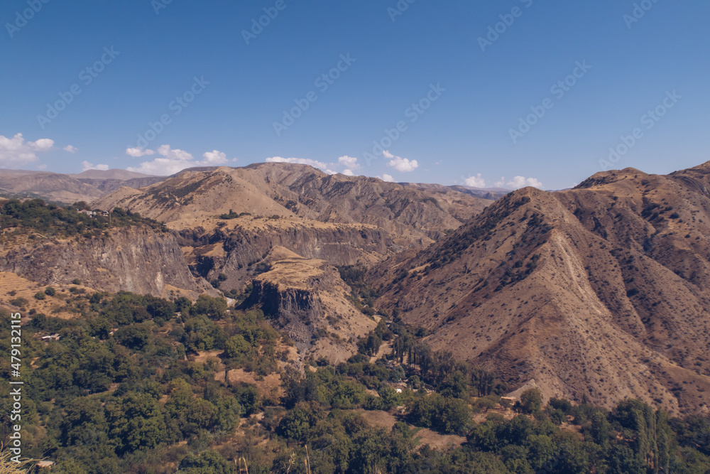 Armenia mountain gorge autumn view. Dry land mountain range a picturesque landscape view with blue sky. Stock photography.