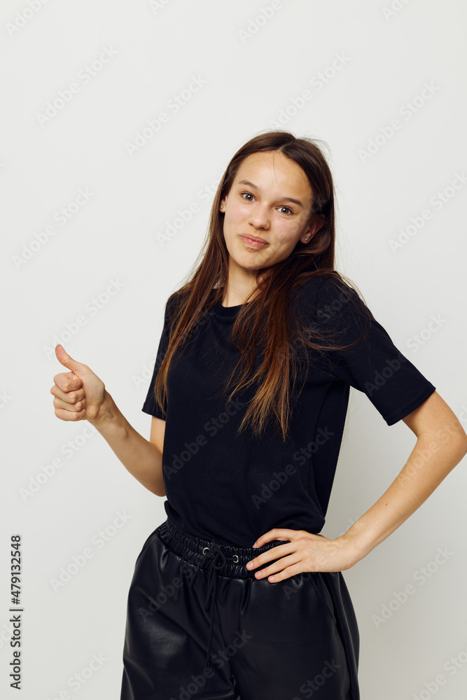 athletic woman in a black t-shirt hand gesture fun isolated background athletic woman in a black t-shirt hand gesture fun isolated background