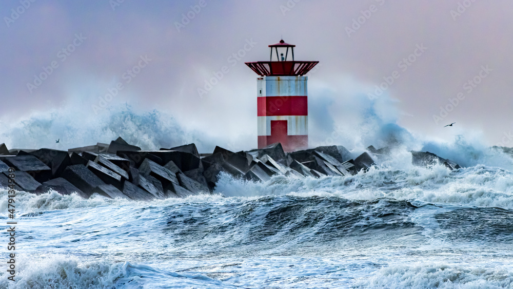 Lighthouse in the surf during storms