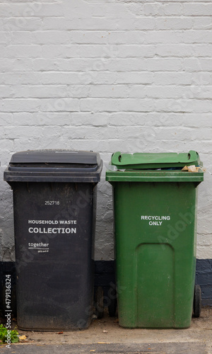 Wheelie bins in UK one black for household waste and one green for recycling
