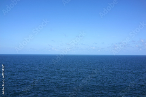 Blue sea water surface on sky background