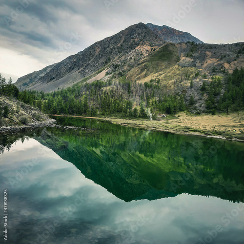 Mountains with a mirror image in a blue lake