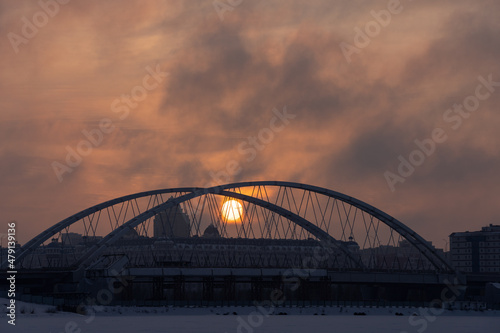 Sunset over the bridge across Ishim river in Nur-Sultan, Kazakhstan. © Kira0Kirina