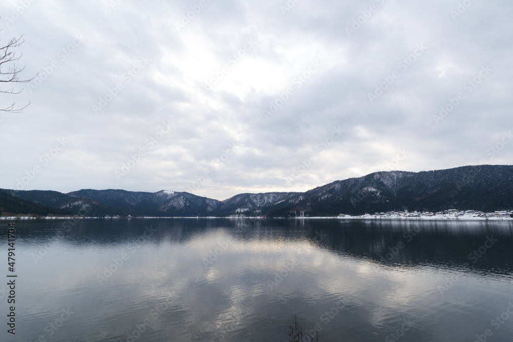 A view of Lake Yogo in Shiga Prefecture in midwinter, with the sky reflecting off the lake surface.