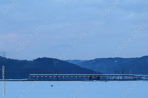 A view of the town of Yogo, Shiga Prefecture, covered with snow on a midwinter night. photo