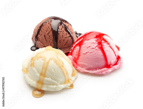 Vanilla, chocolate and strawberry ice cream scoops with syrup isolated on white