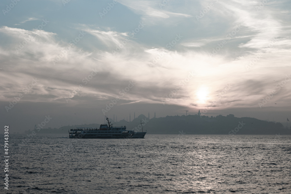 Istanbul background. Silhouette of ferry and cityscape of Istanbul at sunset