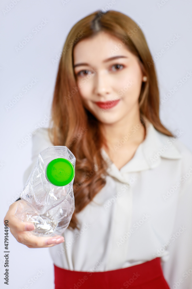 Beautiful cute face young Asian girl campaign says no to plastic, reducing plastic waste, reducing global warming in studio light portrait shot isolated on white background. Environment concept Beautiful cute face young Asian girl campaign says no to plastic, reducing plastic waste, reducing global warming in studio light portrait shot isolated on white background. Environment concept
