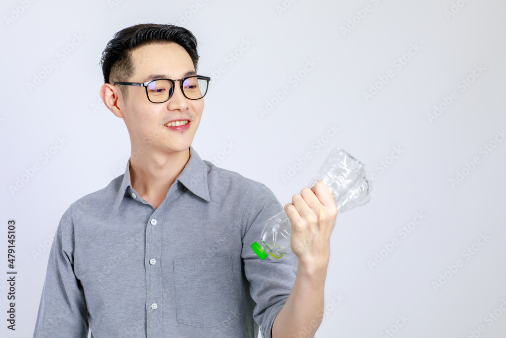 Young, friendly face asian man smile happy, dressed casually campaign say no plastic, reducing plastic, reducing global warming, studio light shot isolated on white background. Environment concept