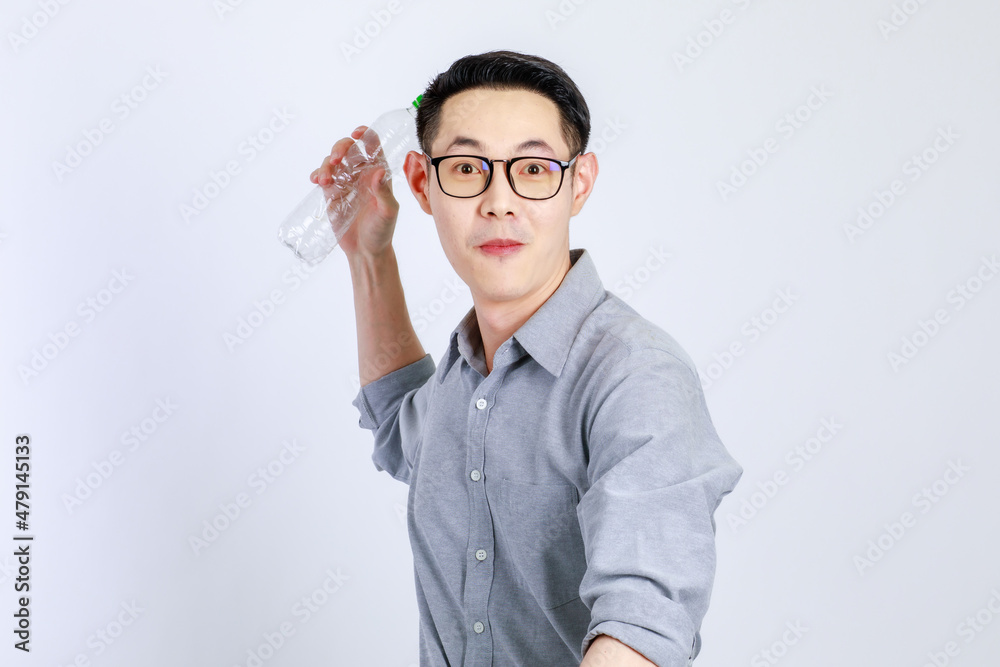 Young, friendly face asian man smile happy, dressed casually campaign say no plastic, reducing plastic, reducing global warming, studio light shot isolated on white background. Environment concept Young, friendly face asian man smile happy, dressed casually campaign say no plastic, reducing plastic, reducing global warming, studio light shot isolated on white background. Environment concept