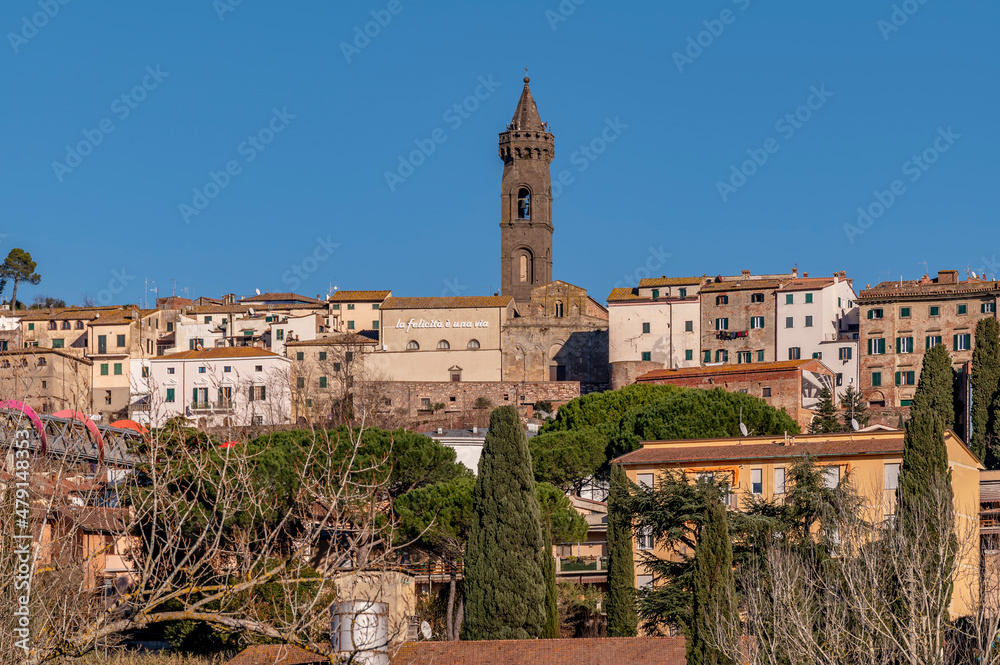 View of the hilltop village of Peccioli, Italy, on a sunny day 