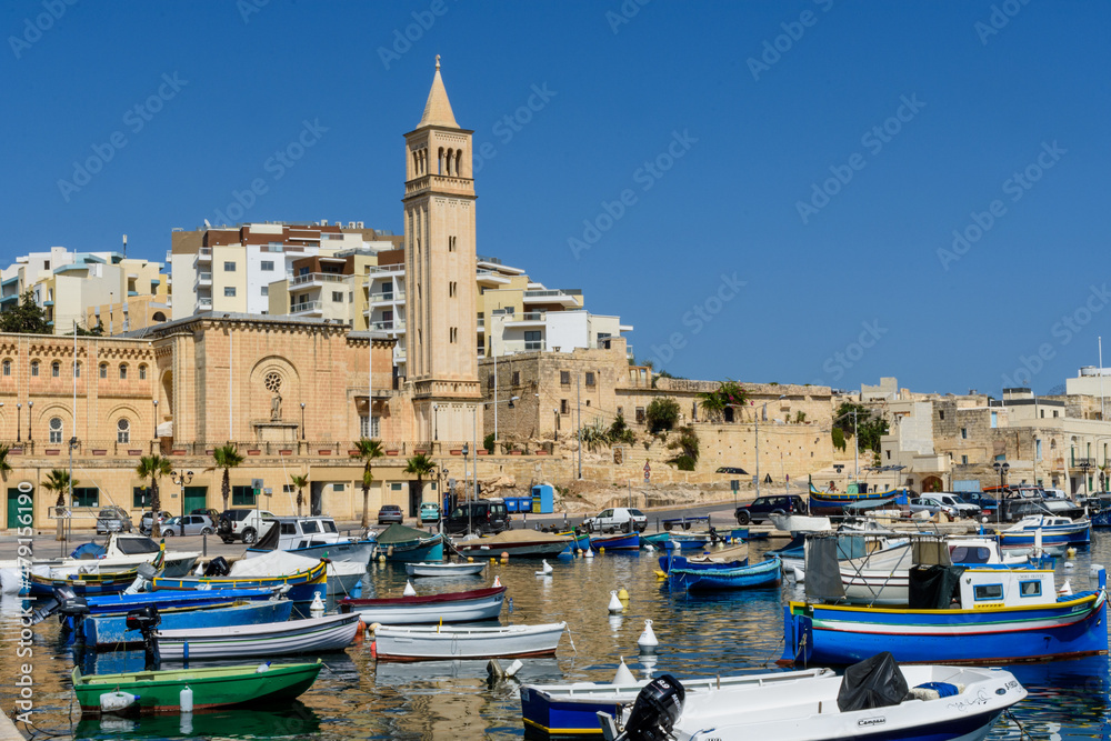 Boats on Marsaskala Harbour with the Parish Church in the background, Marsaskala, Malta.