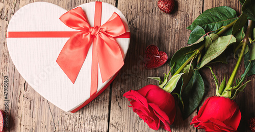 Gift box on a wooden background. Valentine's Day gift.selectiv focus photo