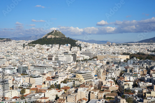 Cityscape of Athens, withe the Greek parliament and the Lycabettus hill located in the background. Photo taken from the Acropolis walls.