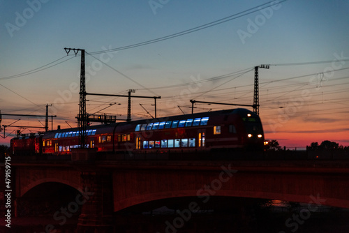 Train at sunset. Railroad at sunset. Industrial landscape with railway. Heavy industry. 