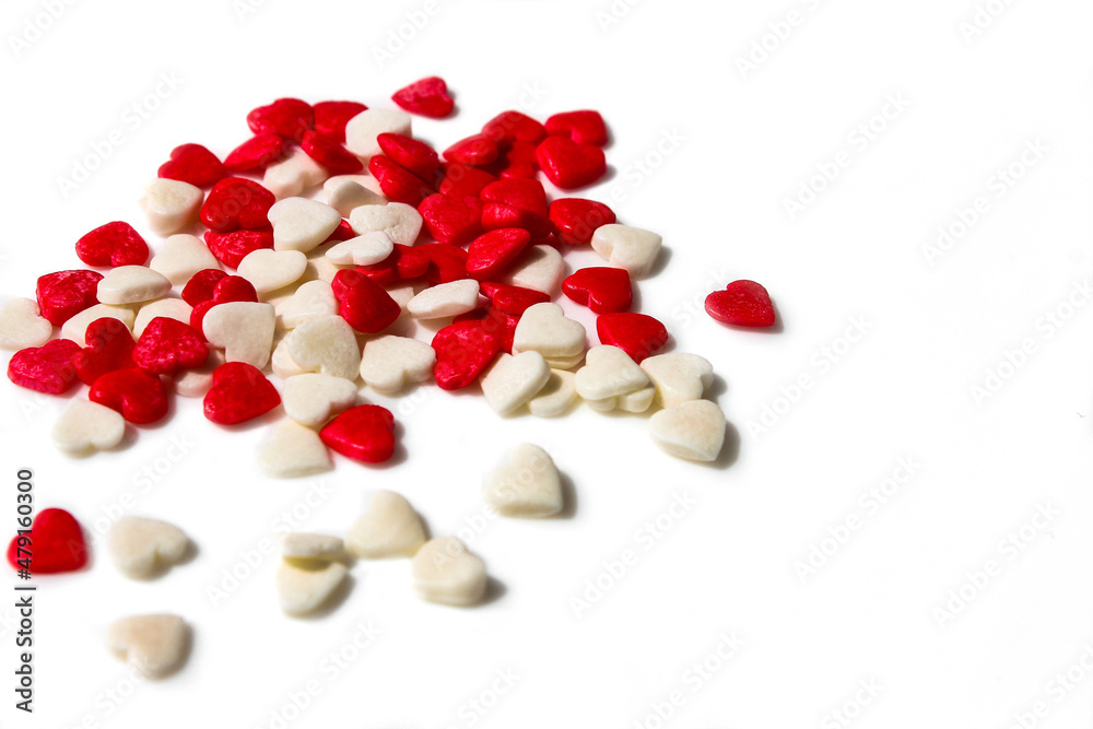 Many small white and red hearts on a white isolated background. The concept of love and romance. Romantic background composition. Valentine's Day Many small white and red hearts on a white isolated background. The concept of love and romance. Romantic background composition. Valentine's Day
