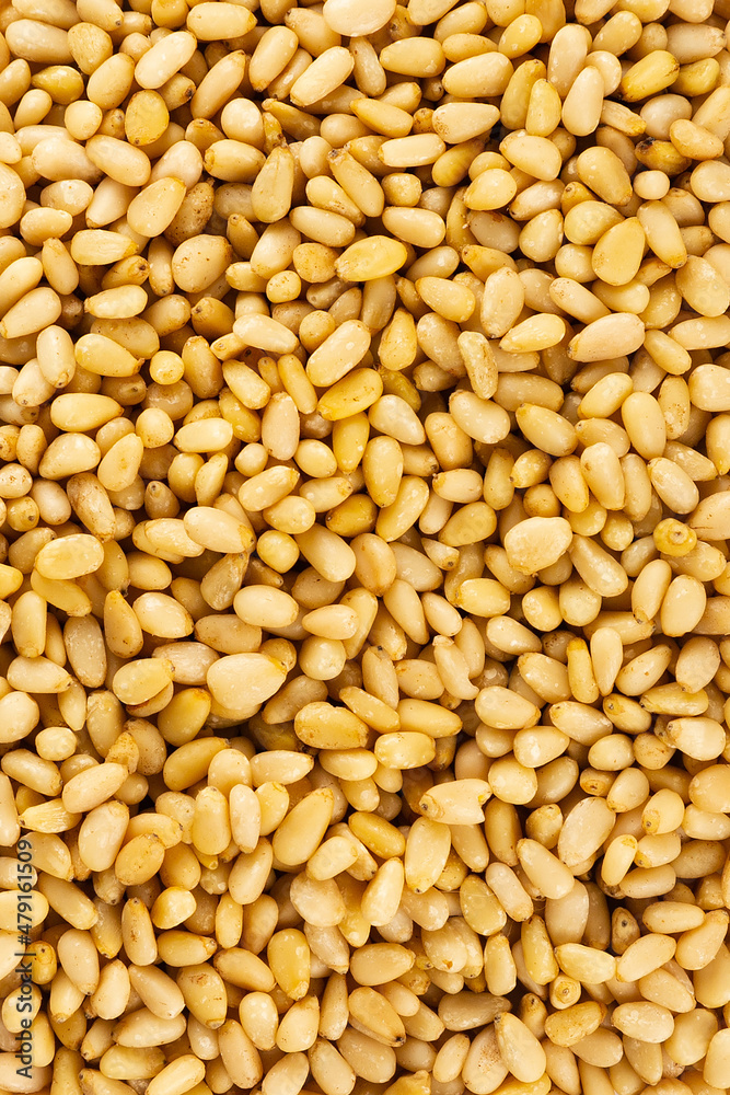 Peeled golden pine nuts top view from siberia Peeled golden pine nuts top view from siberia