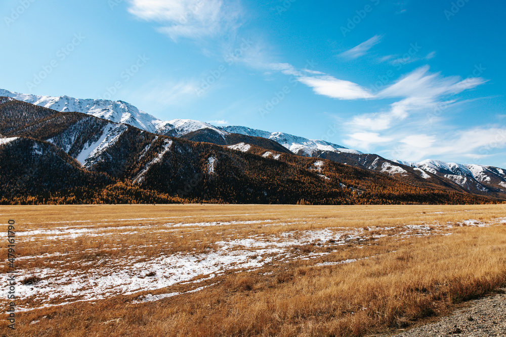 High cliffs in the mountains with snow on the peaks in Altai High cliffs in the mountains with snow on the peaks in Altai