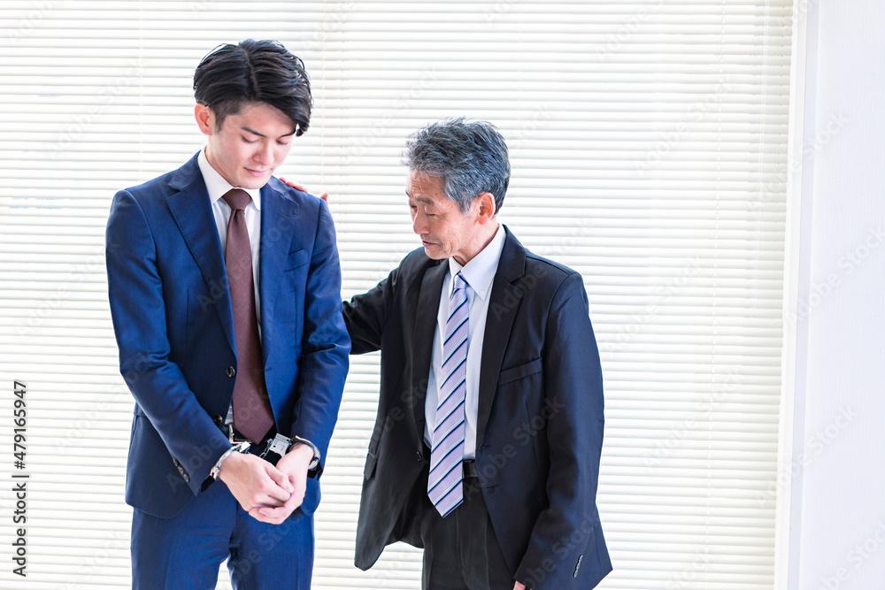 逮捕されたビジネスマンと上司