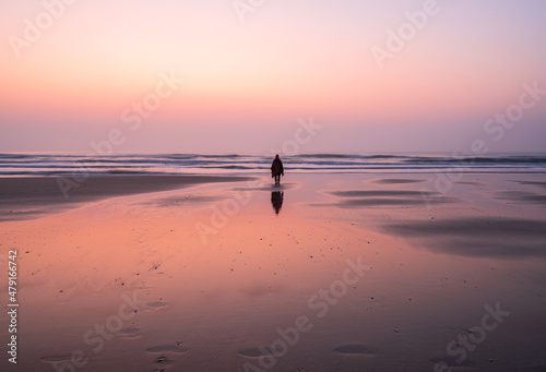 one person standing on the the beach in sunrise © imphilip