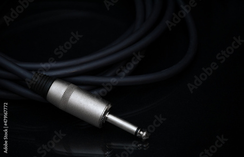 TRS connector for the analog audio signal are placed against a black background. Professional jack connector for sound equipment. Audiophile technologies concept. photo