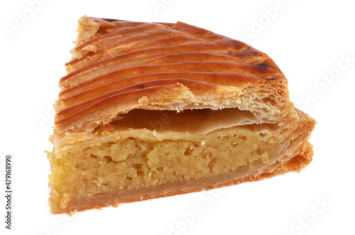 Fotografie Part de Galette des rois en gros plan sur fond blanc