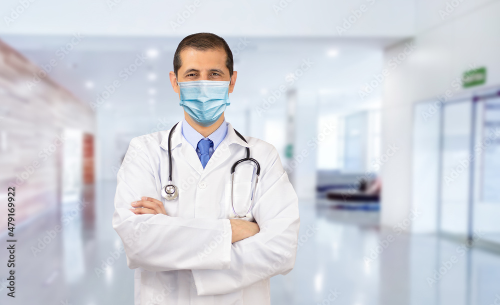 Portrait of a happy doctor working wearing a facemask to avoid COVID-19.Pandemic concepts and security with copy space. Portrait of a happy doctor working wearing a facemask to avoid COVID-19.Pandemic concepts and security with copy space.