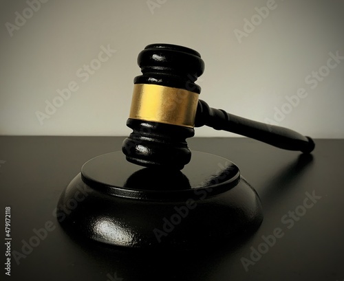 Fotografie, Obraz Close up of judge gavel on dark table background. Law concept.