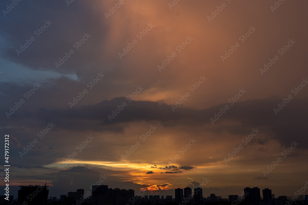 Golden hour orange sunset in the big city silhouette