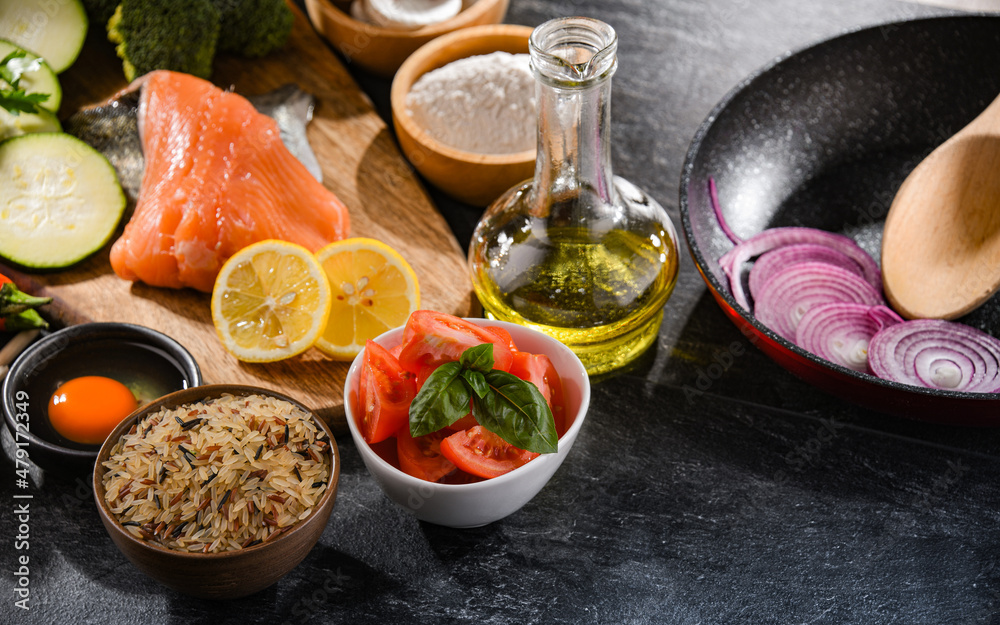 Fresh food ingredients prepared for cooking on a kitchen table Fresh food ingredients prepared for cooking on a kitchen table