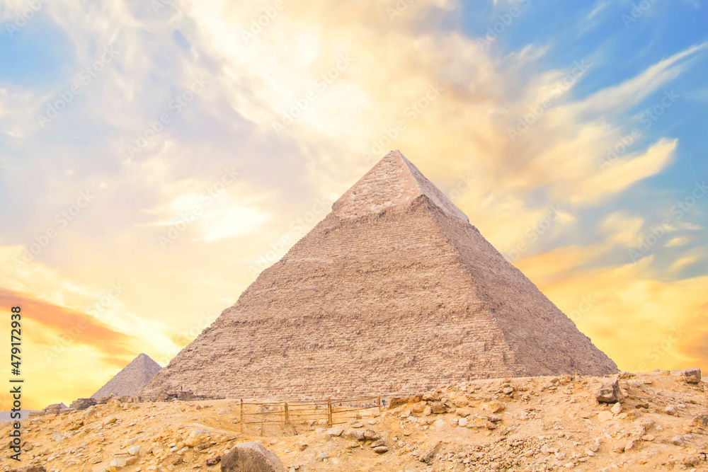 Great Sphinx against the background of the pyramids of the pharaohs Cheops, Khafren, and Mikerin in Giza, Egypt