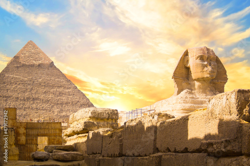 Great Sphinx against the background of the pyramids of the pharaohs Cheops, Khafren, and Mikerin in Giza, Egypt photo