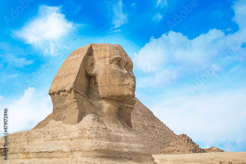 Great Sphinx against the background of the pyramids of the pharaohs Cheops  Khafren  and Mikerin in Giza  Egypt