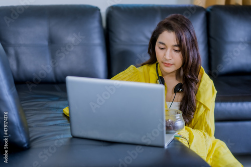 happy woman working on laptop © Abdul