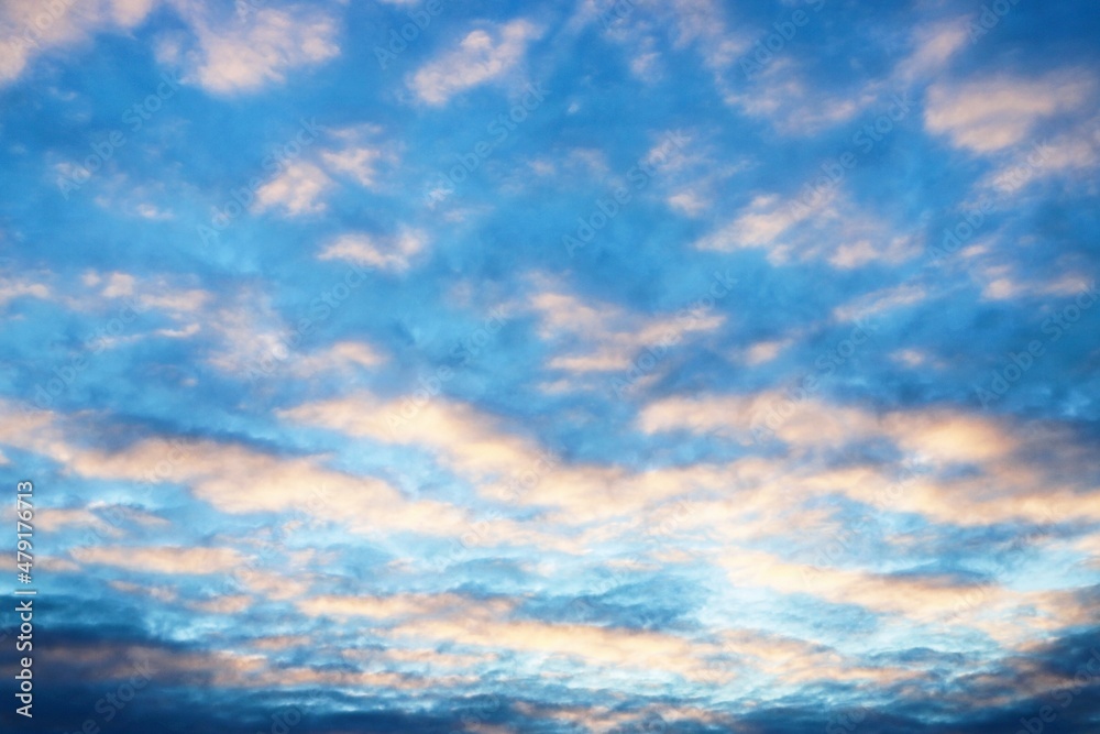 beautiful sunset sky with cirrus and cumulus clouds in late autu