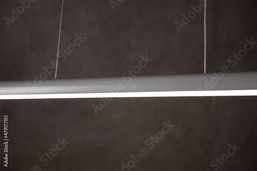 Close-up LED lamp on a concrete wall. LED lamp black background