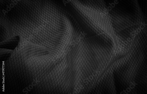 black cotton material with an interesting pattern