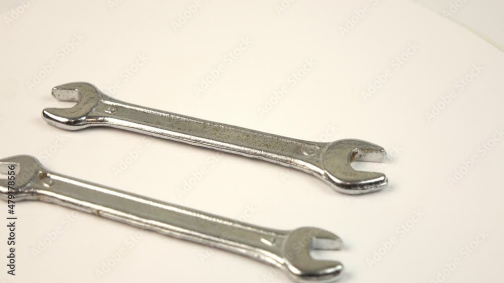 Wrenches on rotating background. Work tools Wrenches on rotating background. Work tools