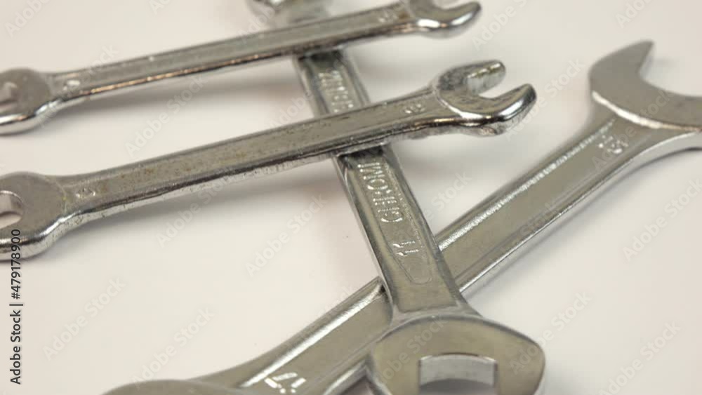 Wrenches on rotating background. Work tools Wrenches on rotating background. Work tools