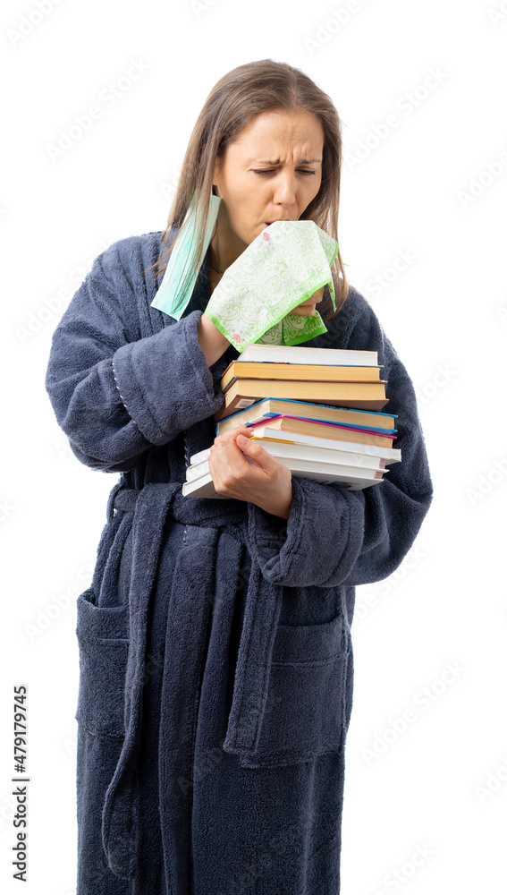 A woman in a bathrobe holds a lot of books and fruits, oranges. sneezes and coughs into a handkerchief, relaxes with an interesting book. Self isolation. coronavirus, flu, epidemic. isolated. A woman in a bathrobe holds a lot of books and fruits, oranges. sneezes and coughs into a handkerchief, relaxes with an interesting book. Self isolation. coronavirus, flu, epidemic. isolated.