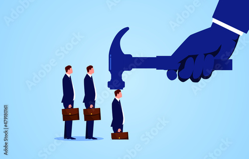 Businessman hits the hammer of the big hand into the ground