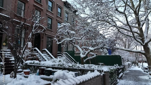 alt moving backward along snow covered sidewalk in Carroll Gardens Brooklyn photo