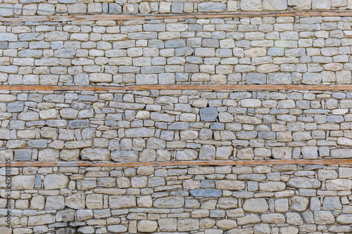 House wall made of processed river stone