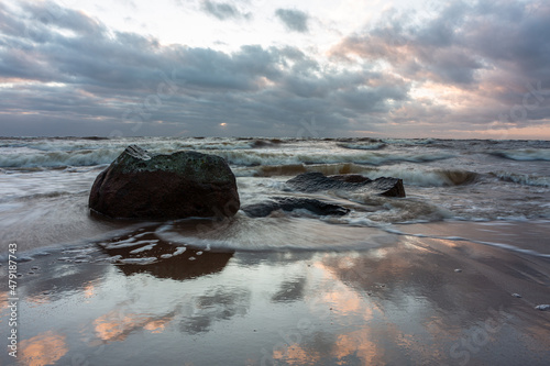 Fototapeta Naklejka Na Ścianę i Meble -  Baltic Sea rocks and beach sand at sunset