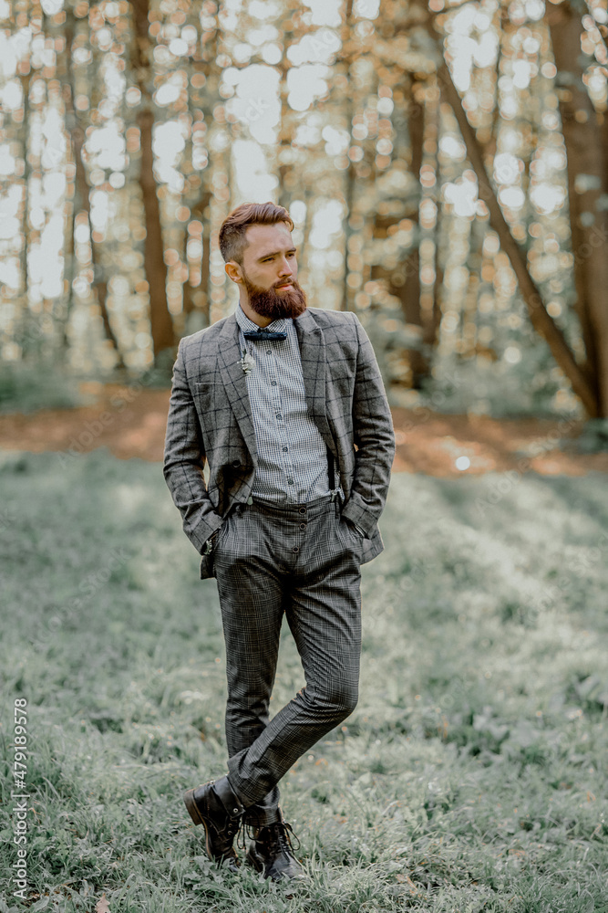 Handsome bearded groom in the Park. Wedding on the nature. Handsome bearded groom in the Park. Wedding on the nature.