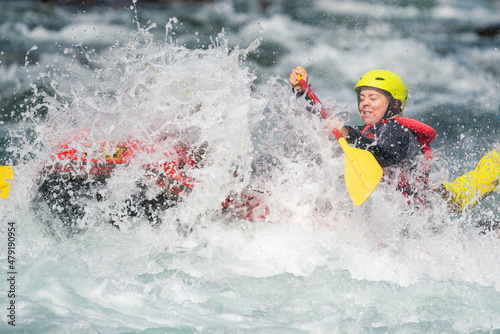 Girl and heavy water splash in river rafting expedition. High speed sports photography. Sport portrait. © Jon Anders Wiken
