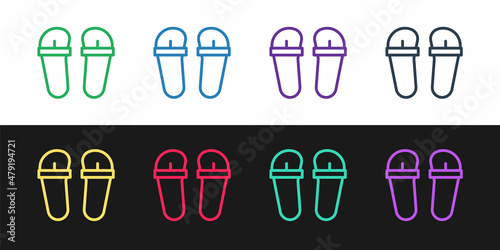 Set line Flip flops icon isolated on black and white background. Beach slippers sign. Vector