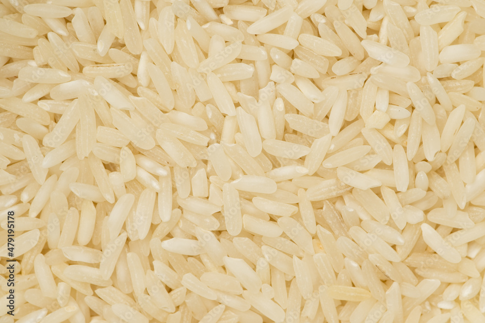 Long grain rice background or texture. Macro, top view Long grain rice background or texture. Macro, top view