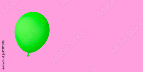Grüner Luftballon isoliert auf pinkfarbenem Hintergrund